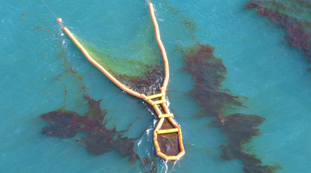 Drone image of the NOFI Current Buster in operation collecting oil during an active spill.