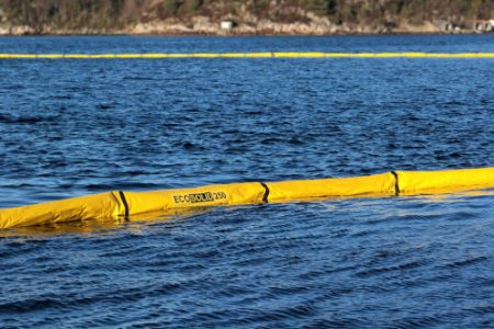 Yellow ECOSOLID harbour Containment boom deployed in blue ocean